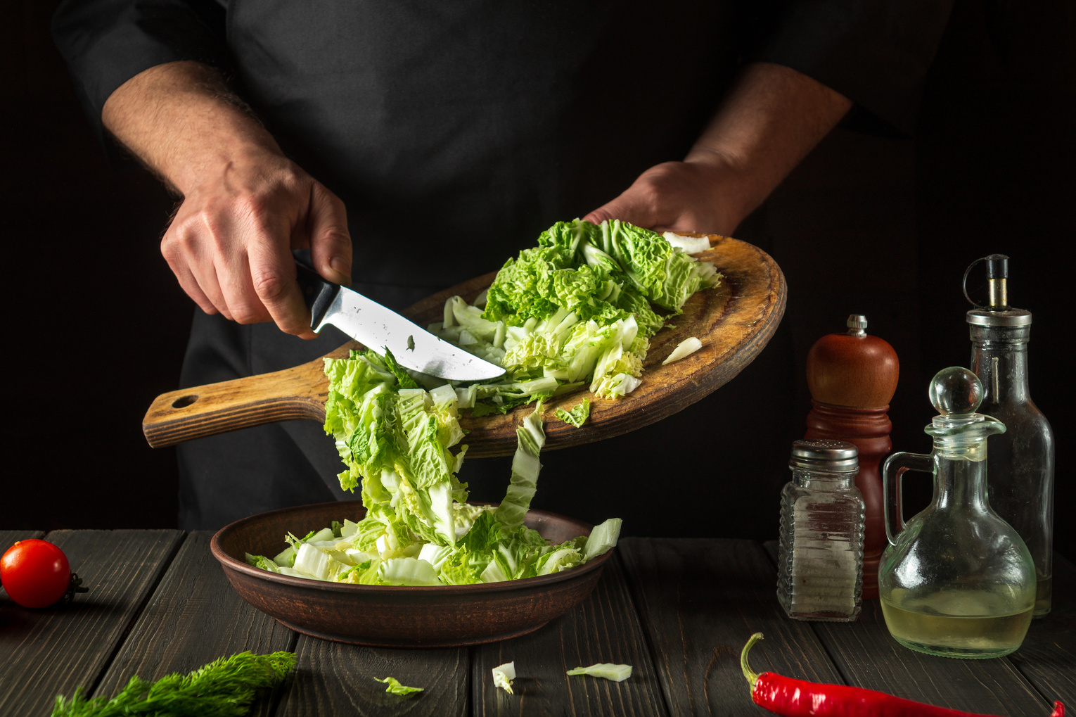 Napa cabbage salad preparation. Professional chef while working