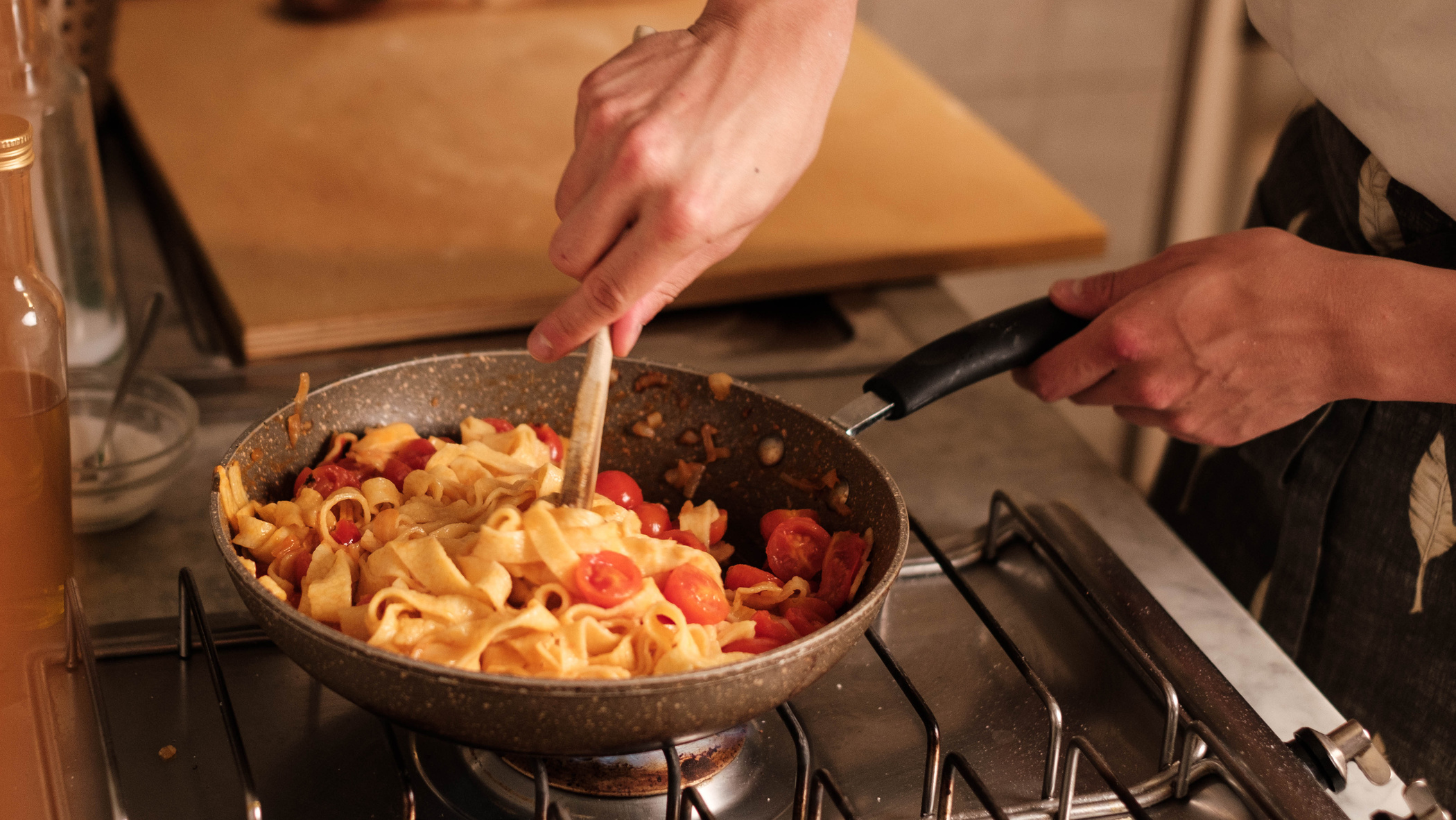 Person Cooking Pasta Dish in a Pan